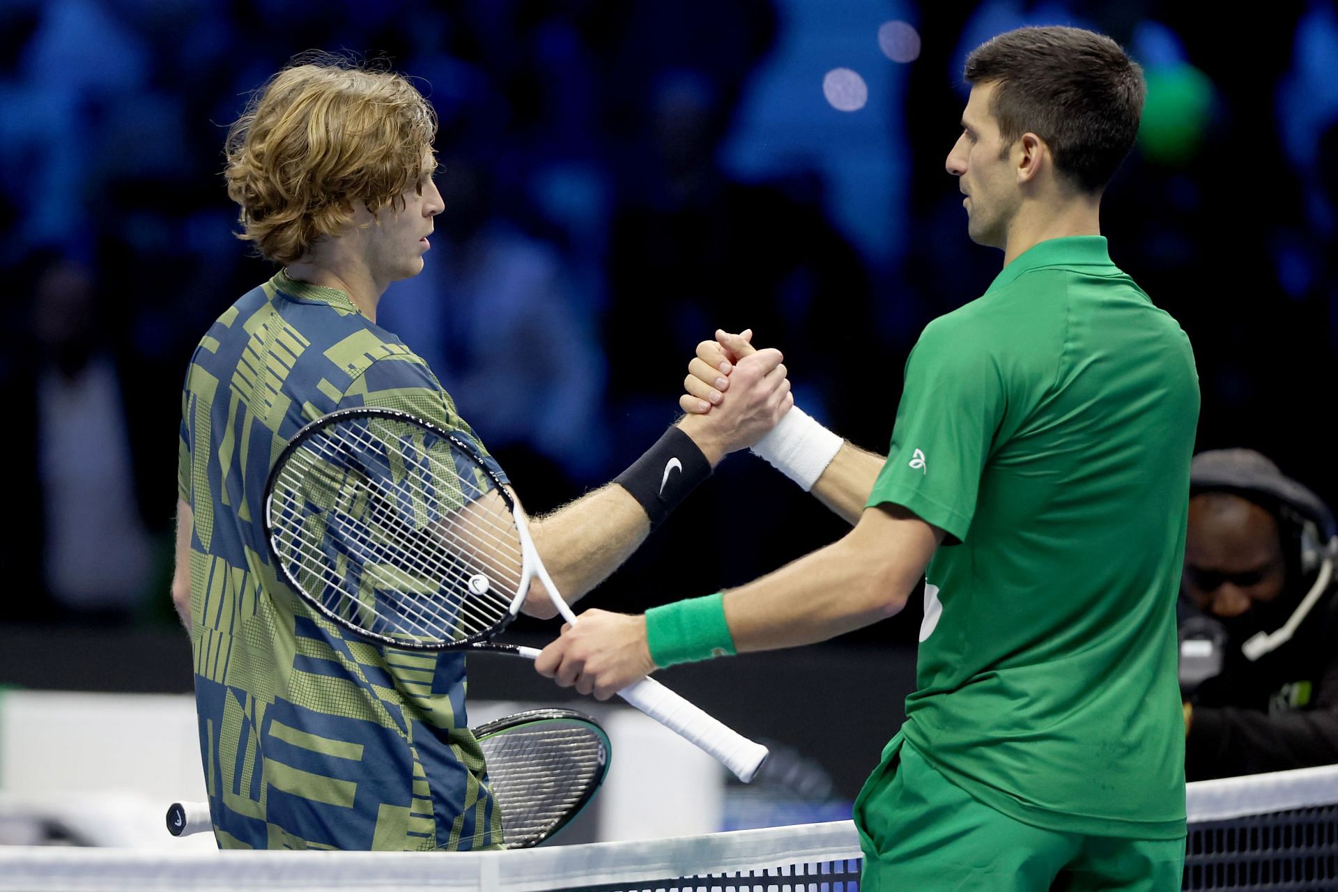Andrey Rublev (L) and Novak Djokovic